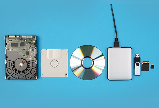 Some different types of hard drives and other electronic media ready for shredding
