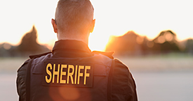 An image of a Sheriff from behind